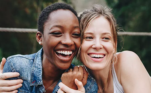 Two women smiling